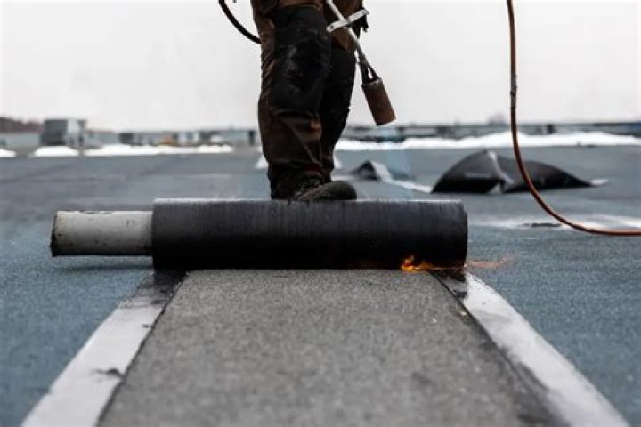How do you apply asphalt roll roofing