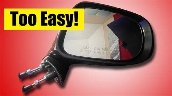How do you attach a side view mirror to glass