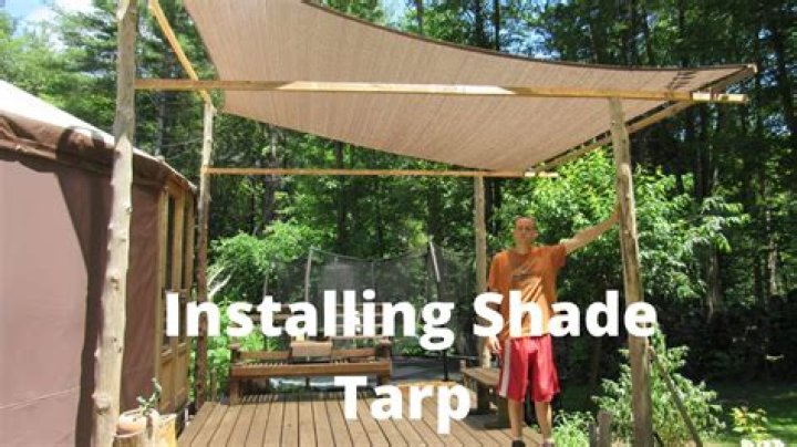 How do you attach a tarp to a pergola