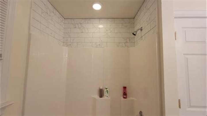How do you protect a wall above a shower