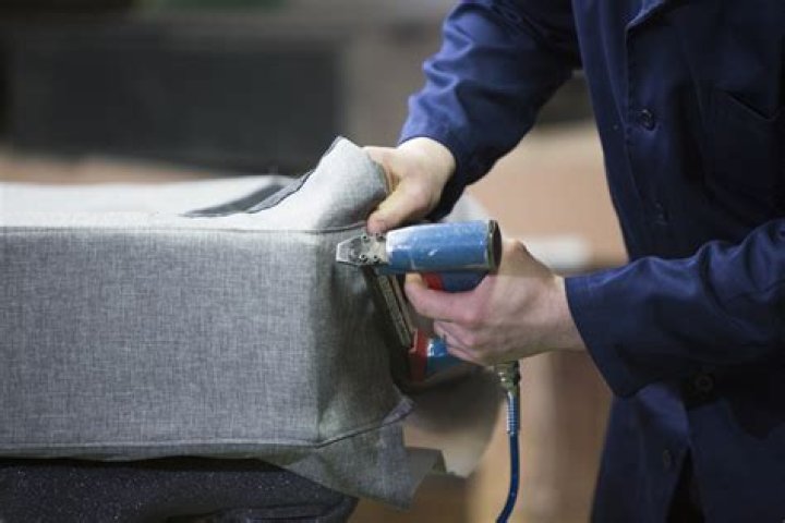 How do you reupholster a couch with a staple gun