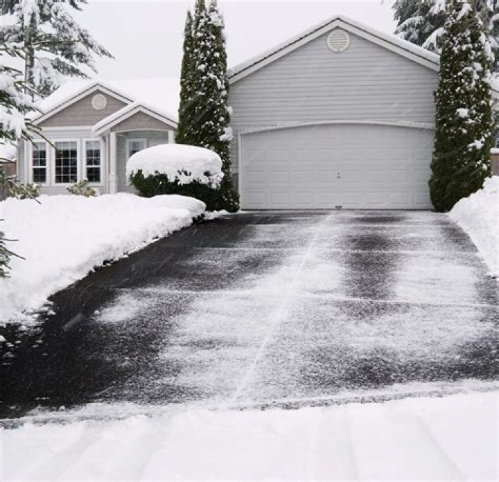 How do you spread salt on a driveway