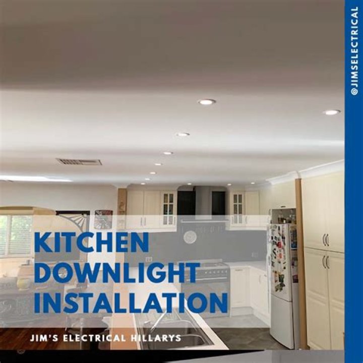 Where should downlights be placed in a kitchen