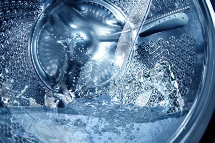 Why is there water in the bottom of my washing machine
